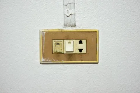 Old switch on white wall Stock Photos