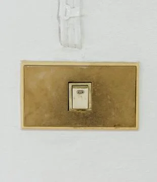 Old switch on white wall Stock Photos