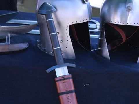 Old sword and helmets Stock Photos