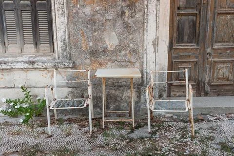 Old table and chairs Stock Photos