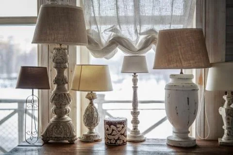 Old table lamp standing on the table, carved legs Stock Photos