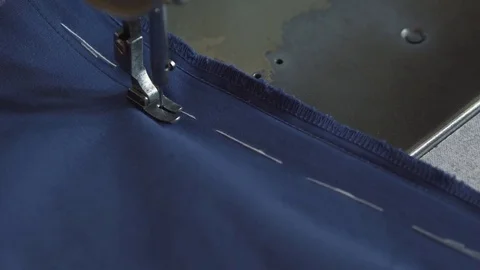 An old tailor works on sew machine Stock-Footage 76126573