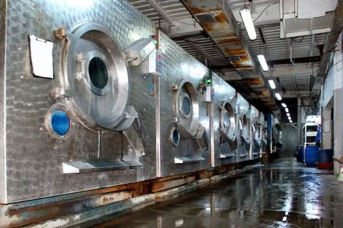 Old tailoring workshop and worn washing machines Stock Photos