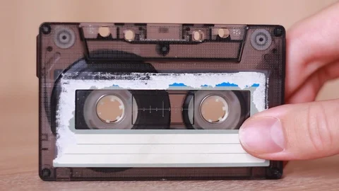 Old tape cassette in hand Video stock 87971401