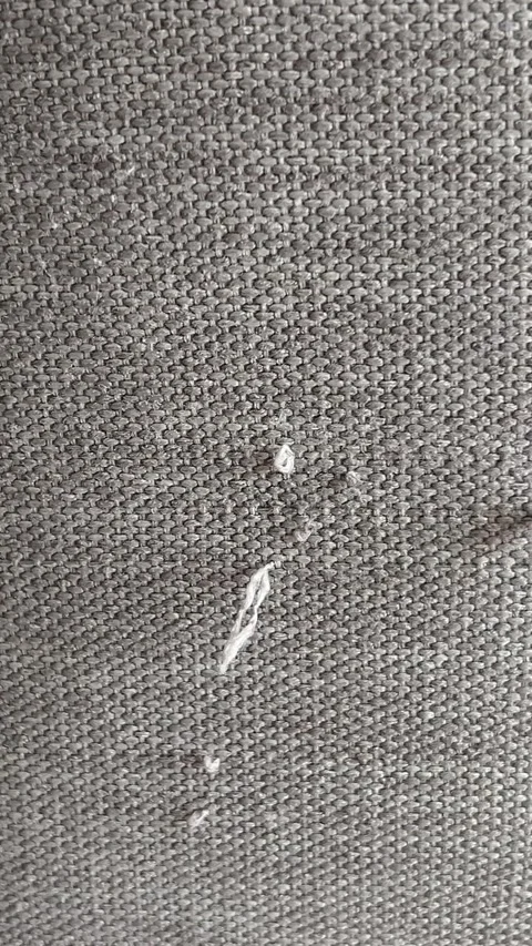 An old, tattered chair with drawstrings Moved the sofa and cause the scratches Stock-Footage 322136608