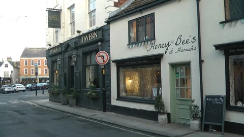 Old Tavern on corner of street Stock Footage 104350397