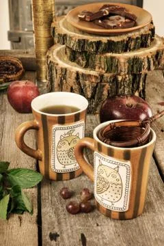 Old tea cups with strainer on retro vintage kitchen table Stock Photos