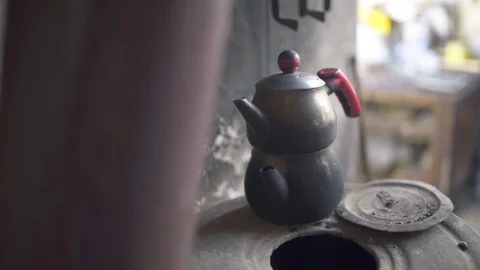 Old tea pot on the stove. Stock Footage 124653328
