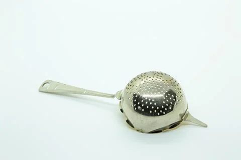 An old tea sifter isolated on white Stock Photos