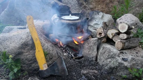 The old teapot boils on a marching fire Stock Footage 80281075