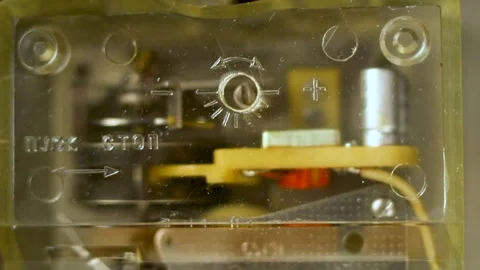 Old technical hardware showing electrical parts inside a translucent protective Stock Footage 335541252