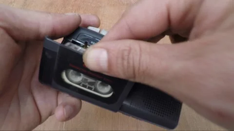 Old Technology - Handheld voice tape recorder, Microcassette audio recorder Video stock 171079630