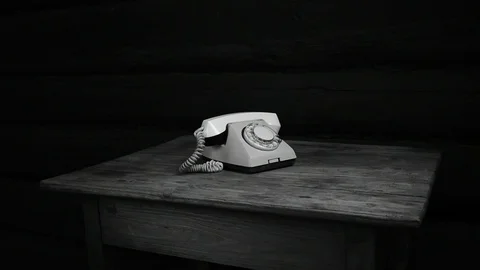 Old telephone on the table black and white Stock Footage 114351585