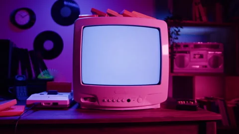 Old Television with Blue Interference Screen in Retro Gaming Room Loop Stock Footage 341590541