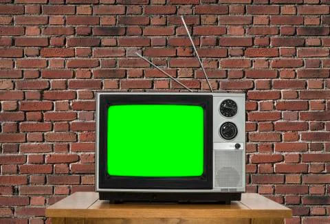 Old Television with Chroma Key Green Screen and Brick Wall Stock Photos