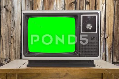 Old Television With Chroma Key Green Screen And Rustic Wood Wall