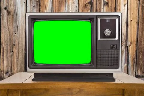 Old Television with Chroma Key Green Screen and Rustic Wood Wall Stock Photos