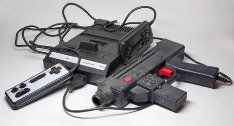 Old television game console system. 8-bit retro game console in black plast.. Stock Photos
