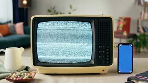 Old television with grey blank screen on home background living room, using Stock Footage 169309668