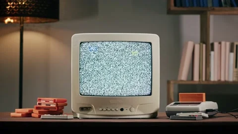 Old television with grey interference screen on home background. Close-up of Vídeo Stock 169114611