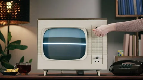 Old television with grey interference screen on home background. Close-up of Stock Footage 169115349