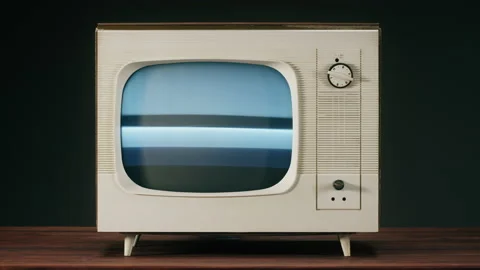 Old television with grey interference screen on black background. Close-up of Stock Footage 169116220