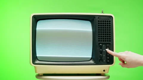 Old television with grey interference screen on chroma green background. Close Stock Footage 169195944