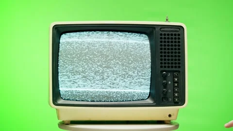 Old television with grey interference screen on chroma green background. Close Stock Footage 169196678