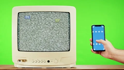 Old television with grey interference screen on green background and smartphone Stock-Footage 169196713