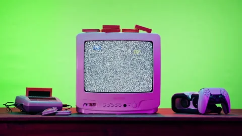 Old television with grey interference screen on green neon background. Close-up Stock Footage 169197001