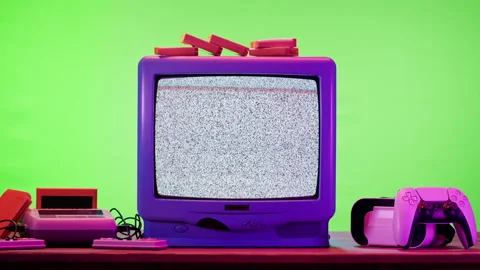 Old television with grey interference screen on green neon background. Close-up Stock Footage 169198248