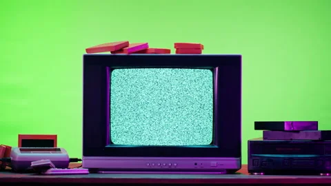 Old television with grey interference screen on purple neon background. Close-up Stock Footage 169198894