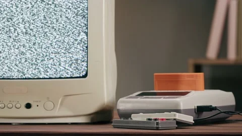 Old television with grey interference screen on home background. Close-up of Stock Footage 182006535