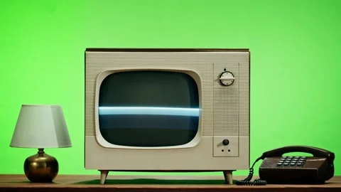 Old television with grey screen on chroma green background. Close-up of vintage Stock Footage 169194967