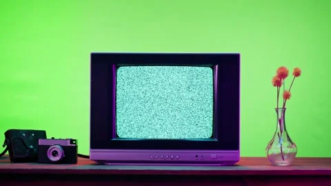 Old television with grey screen on chroma green background. Close-up of vintage Stock Footage 169195626