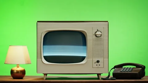 Old television with grey screen on chroma green background. Close-up of vintage Stock Footage 169198882