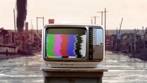 Old Television Set with Exploding Green Screen on a Street of a Ruined City. 4K. Video stock 197483270
