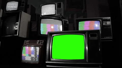 Old Television Set with Green Screen and Many Retro TVs. BW Tone. Stock Footage 230707396
