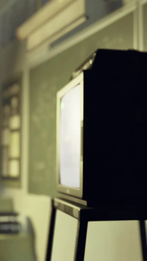 Old television set located in a classroom during a training session Stock Footage 332231887