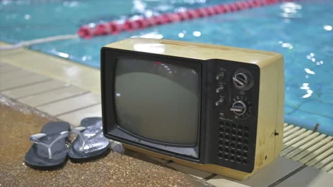 Old television set on the side of the pool Stock Footage 170726022