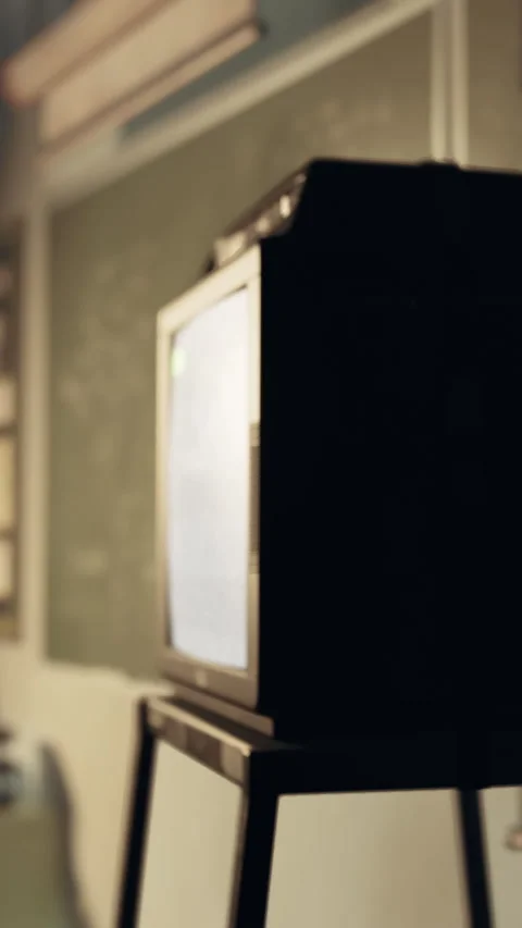 Old television on a stand in a room with a simple wall background Stock Footage 341988199