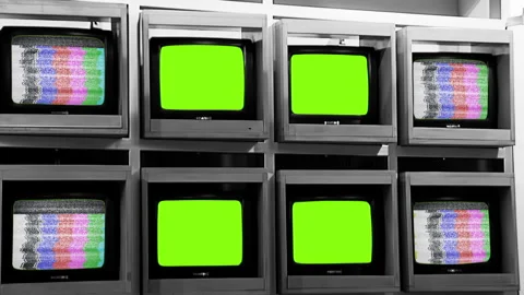 Old Televisions on Display Turning On Green Screens with Test Pattern Signal.   Stock Footage 246831304