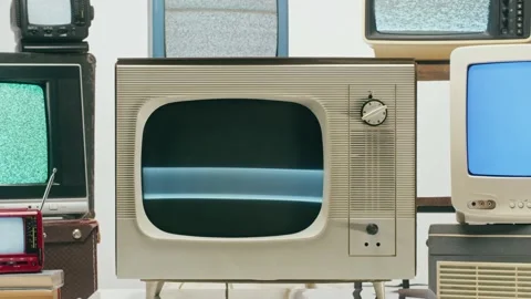 Old televisions with grey interference screen on light background. Vintage tv Stock-Footage 169114095