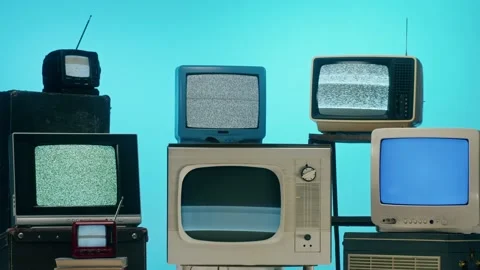 Old televisions with grey interference screen on blue neon background. Vintage Vídeo Stock 169114241