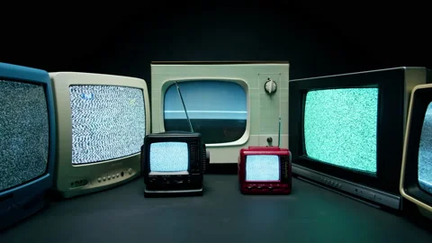 Old televisions with grey interference screen on black background. Vintage tv Stock-Footage 169115521