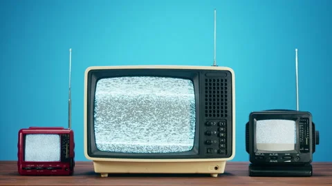 Old televisions with grey interference screen on blue background. Close-up of Stock Footage 169115809