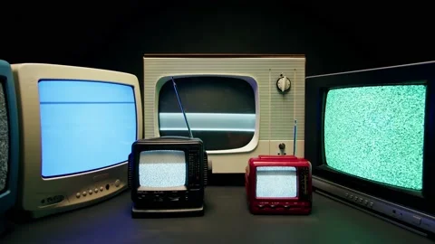 Old televisions with grey interference screen on black background. Vintage tv Stock Footage 169309569
