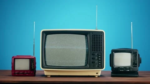 Old televisions with grey interference screen on blue background. Close-up of Stock Footage 169309629