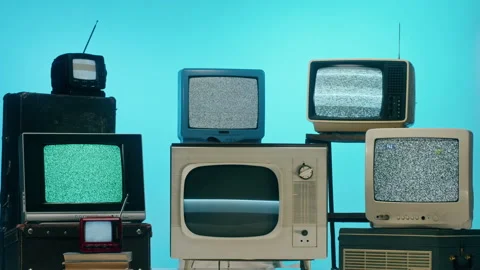 Old televisions with grey interference screen on blue neon background. Vintage Видео 169310078