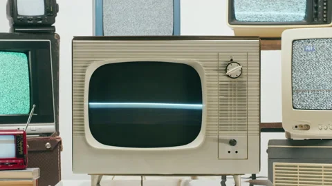 Old televisions with grey interference screen on light background. Vintage tv Stock Footage 169310126